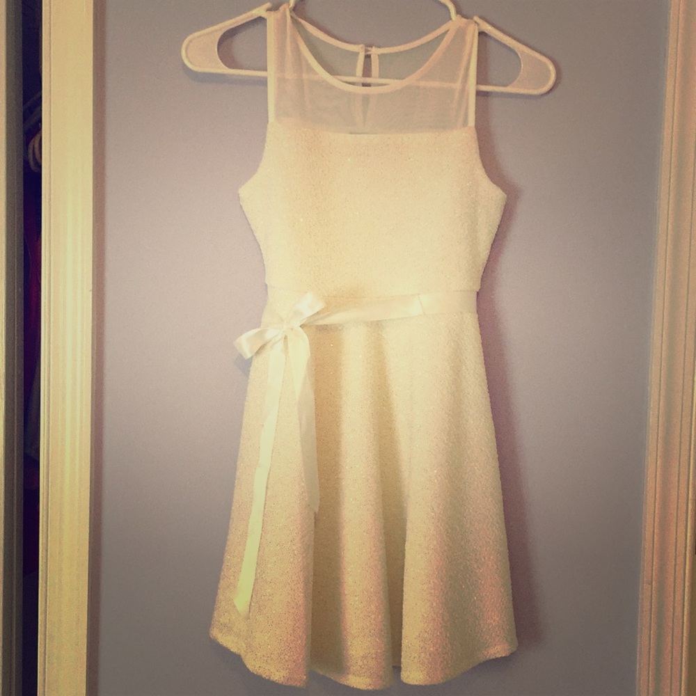 Girl’s white dress with gold sparkle